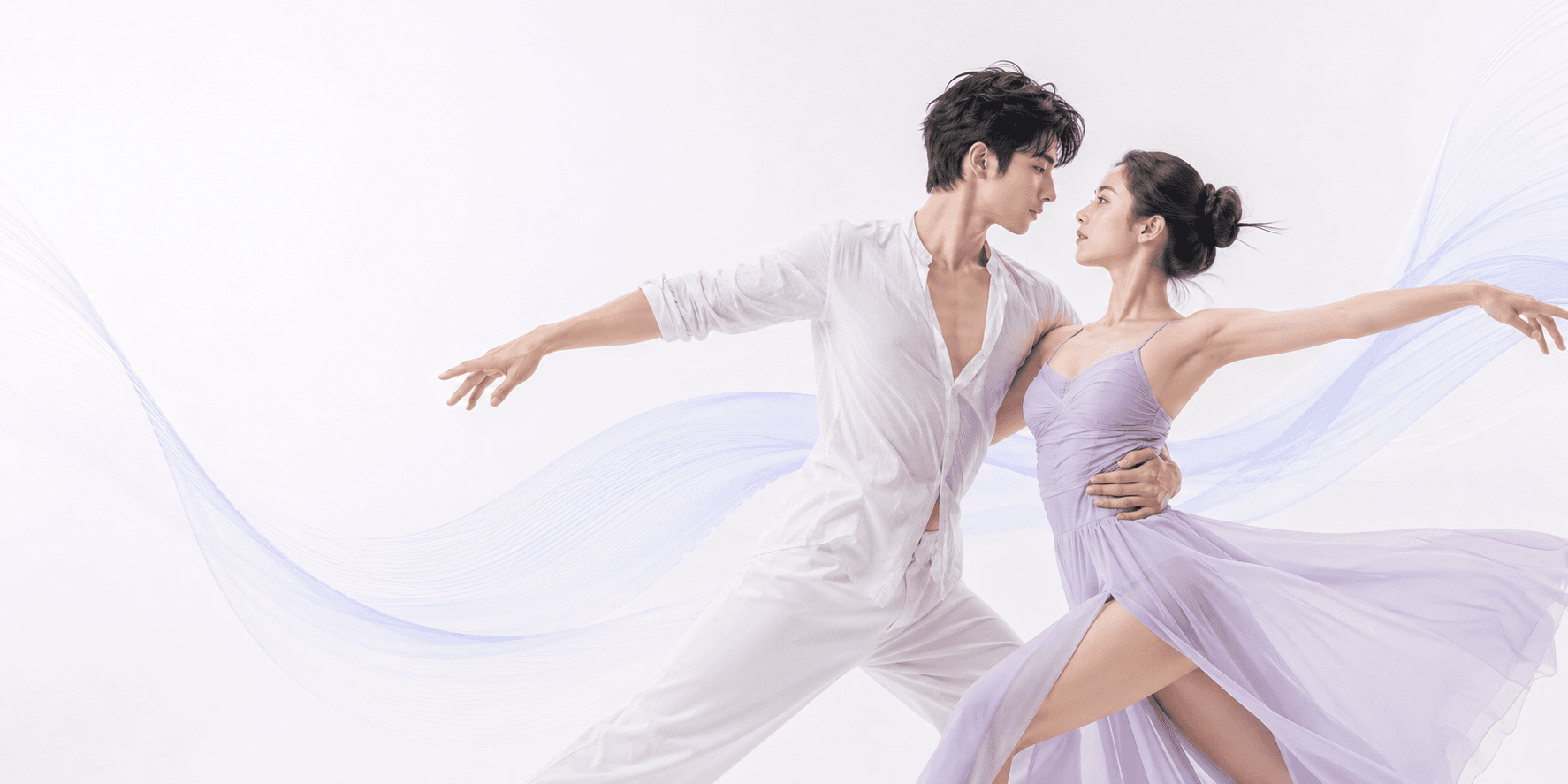 A contemporary dance couple moving in sync